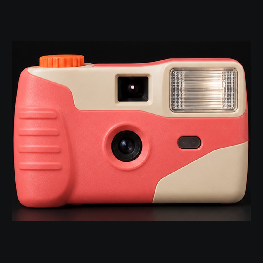 Sunpop, an original coral and cream disposable-style camera with an orange winding wheel